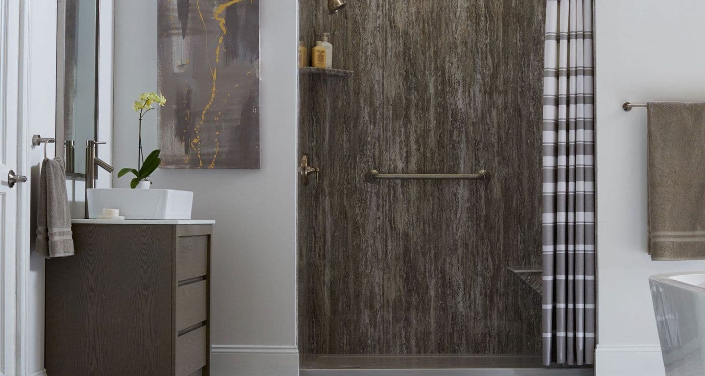 A BathWraps EasyStep Marble Cove Smooth Prairie shower with a built-in seat and a grab bar.